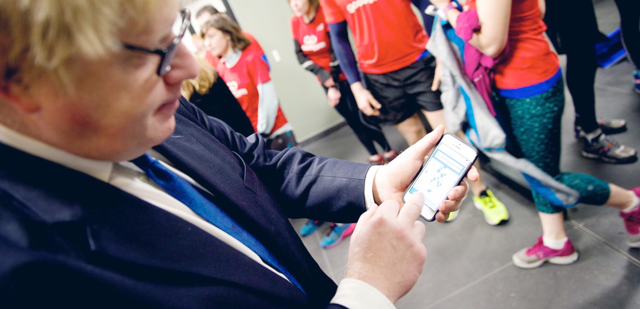 London Mayor Boris Johnson using the Team London App.